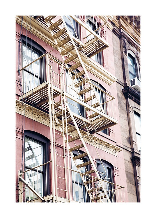  - Photo poster with a fire escape ladder on a pink building facade in New York.